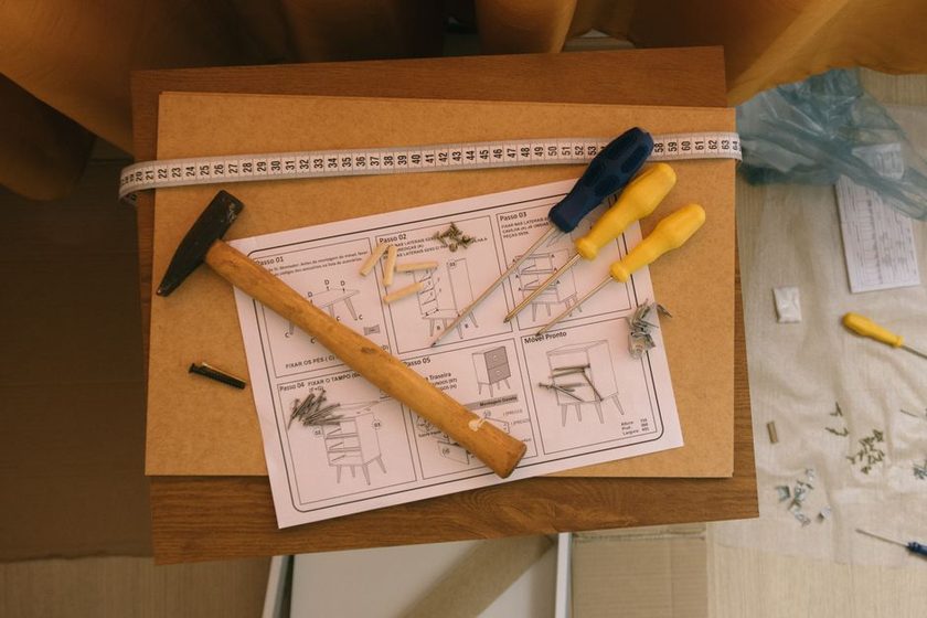 Several flat-pack panels stacked with small gaps visible between edges